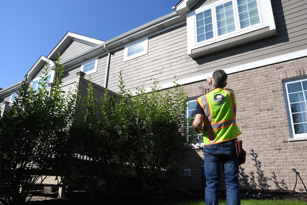Jeff Walters of Prospective Home Inspections examining a home exterior